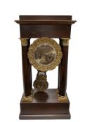 A 19th century French Empire mahogany portico clock, height approx. 50cm