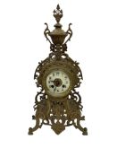 A French gilt-metal mantel clock, with pierced foliate design and enamel dial, 46cm high.