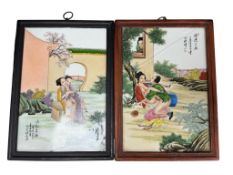 A pair of Chinese enamelled porcelain erotic subject plaques, framed, overall 39 x 29cm