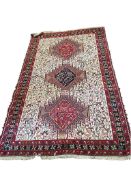 A Senneh ivory ground rug, 202 x 124cm