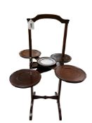 An early 20th century ’Monoplane’ mahogany patent folding cake stand, height 77cm.