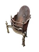 A Georgian-style cast iron and brass fire grate, width 64cm, depth 26cm, height 71cm