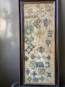 A rare early 17th century spot motif sampler. Worked on fine linen with polychrome silks, in
