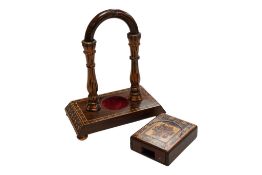 A Tunbridgeware pocket watch stand and another, smaller example, largest 17cm high