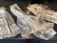 A lace wedding veil and two skirt panels. The veil 19th century cream hand made Carrickmacross,