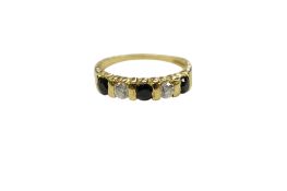 A modern 18ct gold, three stone sapphire and two stone diamond half hoop ring, size M,/N, gross