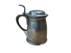 An Archibald Knox pewter tankard, height 17cm.