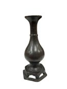 A Chinese bronze baluster shaped vase on hexagonal base, Ming Dynasty, height 19cm.