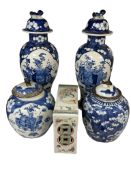 A pair of 19th century Chinese blue and white baluster prunus vases and covers, height 31cm, two