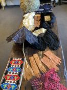Useful for film and tv costume designers. A beaded blouse, silk stole and black skirt length. A pair