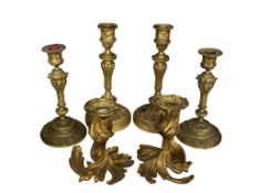 A pair of Empire style ormolu candlesticks (drilled bases) height 24cm, a similar smaller pair of