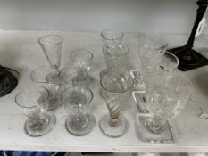 A group of twelve Georgian drinking glasses, comprising four Georgian wrythen ale glasses, three