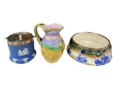 A Wedgwood blue jasperware biscuit barrel with silver-plated mounts, together with a Doulton pottery