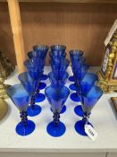 Fifteen Venetian blue glass knopped stem wines in two sizes, larger 19cm.