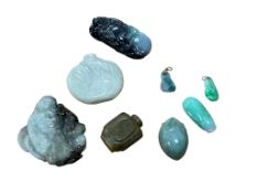 A group of Chinese jadeite carvings including two pendants with hanging loops and two Chinese