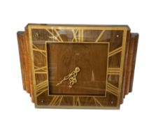 An Art Deco style walnut electric wall clock with Roman numeral dial, width 54cm.