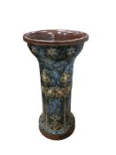 A Royal Doulton Lambeth Stoneware stick stand, height 60cm, diameter 30cm.