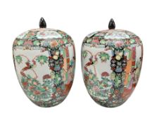 A pair of Chinese famille rose porcelain ovoid jars and covers, decorated with birds and flowers,