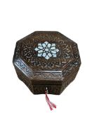 A Moroccan octagonal wooden box, inlaid with mother-of-pearl, 10 x 20cm.