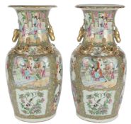 A pair of Chinese famille rose vases, mid 19th century, typically painted with figures amid