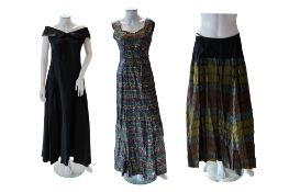 Two ladies late 1930’s-40’s evening dresses and a full length evening skirt. A black taffeta off the