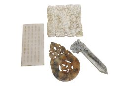 Three Chinese archaistic Jade or hardstone carvings and an inscribed tablet, largest 13cm wide (4)