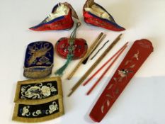 A pair of 20th century Chinese gold embroidered embroidered lotus shoes and a blue silk pouch, a red