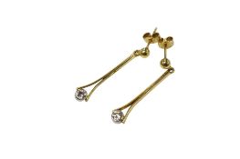 A pair of yellow metal and single stone diamond set drop earrings, the butterflies stamped 750, drop