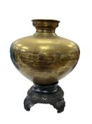 A Chinese brass vessel on hardwood stand, width 35cm, total height 45cm.