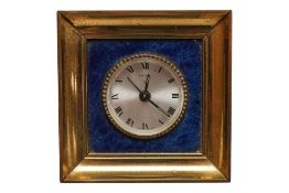 A 1960’s Cartier desk timepiece, with a lapis lazuli mount and gilt frame, 7.5cm high