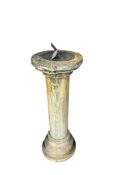 A composition stone sundial, diameter 31cm, height 90cm