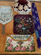 Five items of Victorian and later beadwork, including a large velvet beaded pin cushion, a