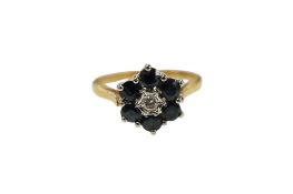 A late 1960's 18ct gold, sapphire and diamond set flower head cluster ring, size K/L, gross weight