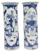 A pair of Chinese blue and white ‘Antiques’ sleeve vases, Kangxi mark, but late 19th century, each