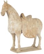 A large Chinese pottery model of a horse, Northern Wei dynasty, 6th-7th century AD, standing four