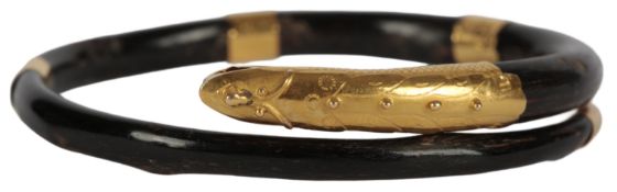 A Sino-Vietnamese yellow metal mounted horn ‘dragon or serpent’ bangle, late 19th/early 20th