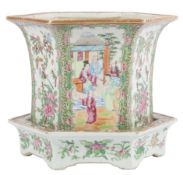 A Chinese Guangzhou-decorated famille rose hexagonal flower pot and stand, mid 19th century,