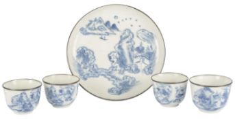 A set of four Chinese bleu de Huê blue and white teabowls and a matching saucer-shaped tray, late