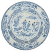 A Chinese blue and white ‘immortals’ dish, Yongzheng period, painted with Wengchang Wang and his two