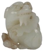 A Chinese pale celadon jade group of a winged lion (pixiu), cub and falcon, 18th / 19th century, the