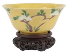 A Chinese enamelled biscuit sancai deep bowl, Kangxi period, incised and enamelled with blossoming