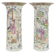 A pair of Chinese Guangzhou-decorated famille rose sleeve vases, c.1830-50, each painted with figure
