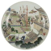 A Chinese famille verte dish, possibly Kangxi period, painted with two warriors battling in an