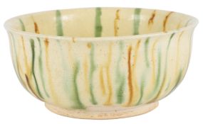 A Chinese sancai bowl, possibly Tang period, partially glazed base, diameter 12.7cm, firing crack to