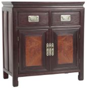 A Chinese hongmu, huali and burrwood panelled cabinet, c.1900, fitted with a pair of frieze drawers,
