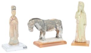 Three Chinese pottery figures, probably Sui dynasty to Ming dynasty, the first a standing figure