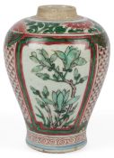 A Chinese wucai vase, Shunzhi period, c.1660, painted to three panels with blossoms, on an iron