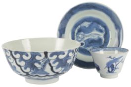 A Chinese blue and white ‘chilong’ saucer dish and a 'lady and boy' cup, Kangxi period and a bleu de