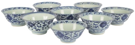 Eight Chinese blue and white bowls, 18th/19th century, each painted to the exterior with lotus