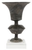 A Chinese neolithic ‘eggshell ‘pottery cup, Longshan culture, c.2500-2000 B.C., the bell-shaped